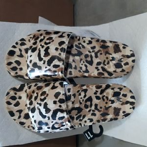 Pool side slides.  Leopard print